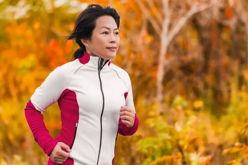 Woman running in the fall
