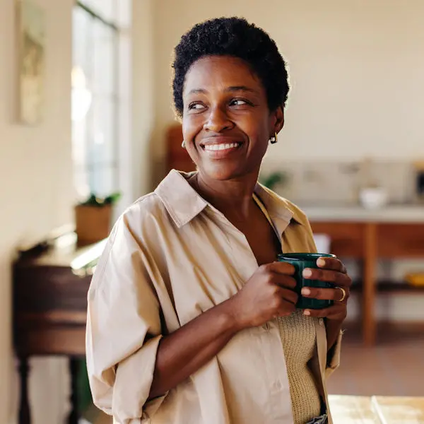 Smiling woman with coffee